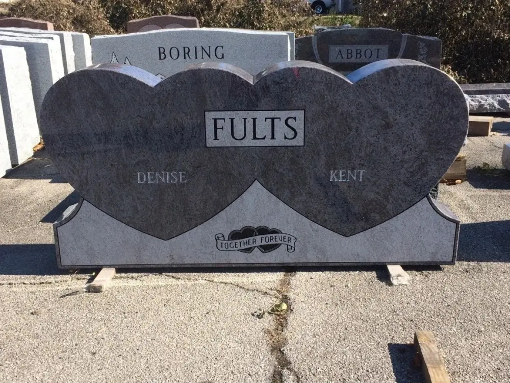 Two joined black granite hearts with a carved rose, Fults